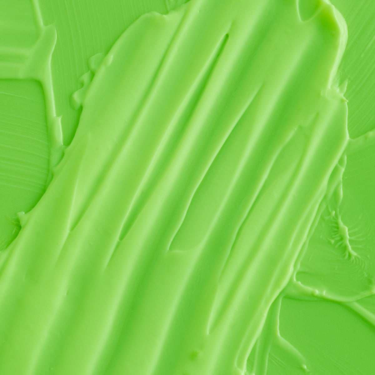 Skincare products styled on a bright lime green background
